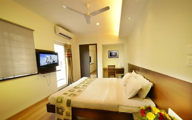 Affordable, homely stays with kitchen and housekeeping for long-term medical care near Ganga Hospital.